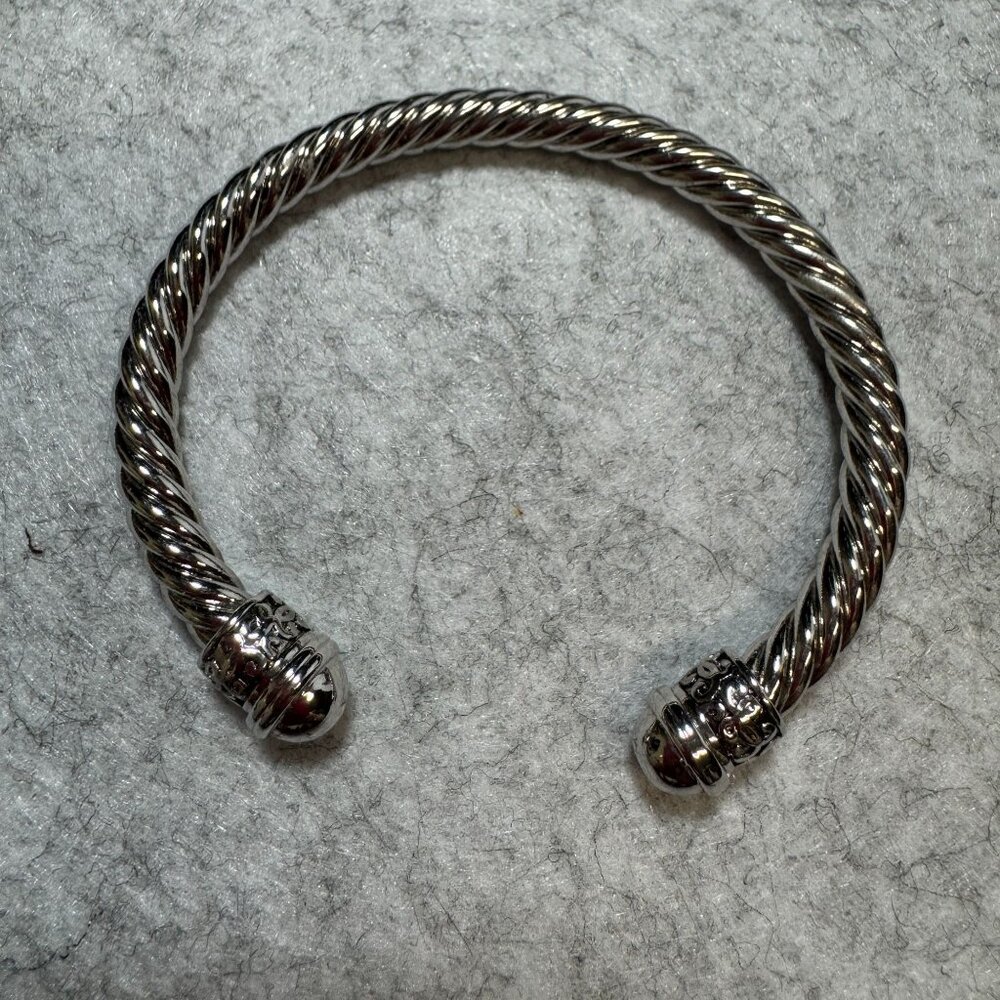 Silver-Plated Twisted Cuff Bracelet With Ornate End Caps
